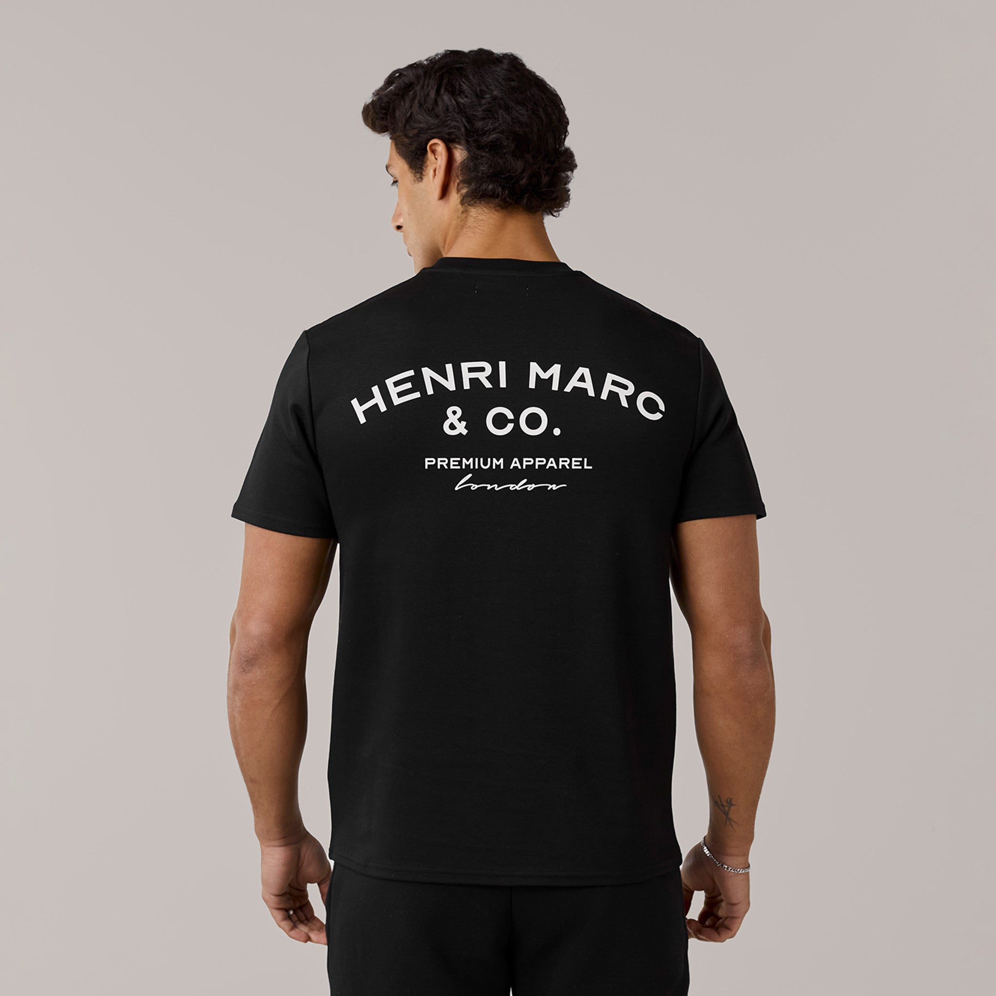 Men's  Black Crew Neck Premium Arch Logo T-Shirt  Henri. Marc & Co  Front View